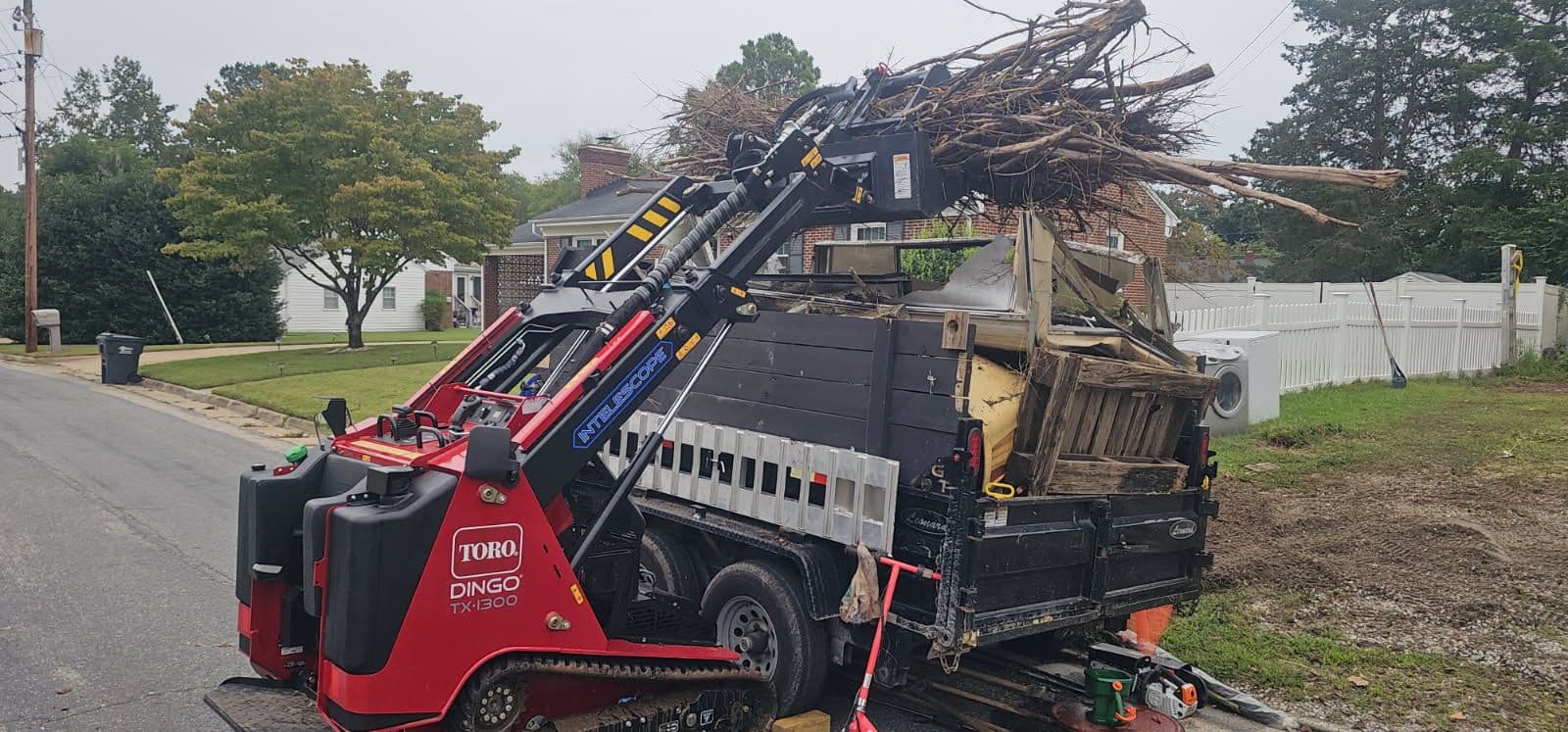 Efficient Yard Cleanup with Toro Dingo TX 1300 in Colonial Heights image